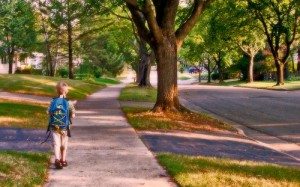lone boy walking to school