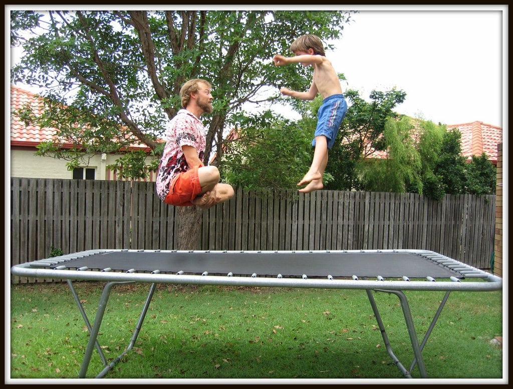dad and son on trampoline
