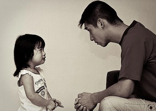 father talking to daughter