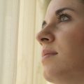 woman looking up thoughtfully