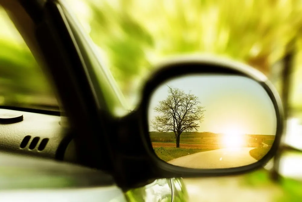 pastoral scene in a rearview mirror
