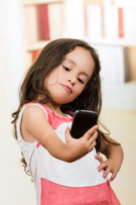 young girl taking selfie